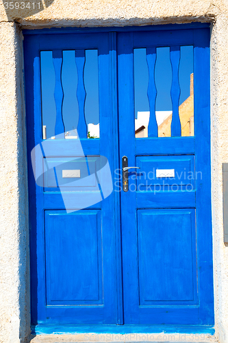 Image of blue door in antique   wall