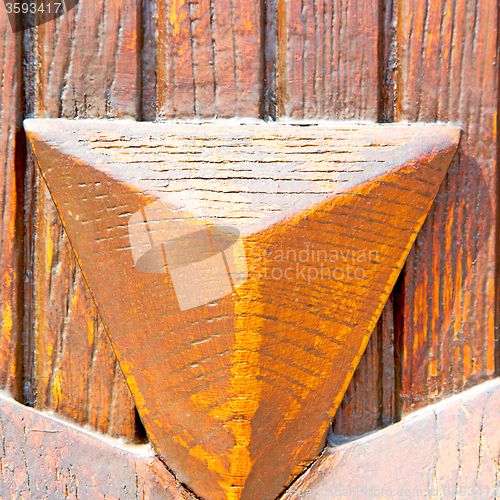 Image of grain texture of a brown antique wooden old door in italy   euro