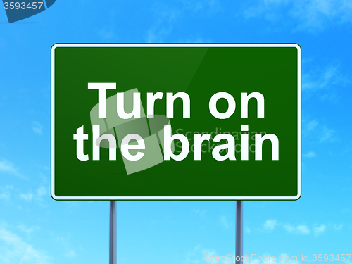 Image of Learning concept: Turn On The Brain on road sign background