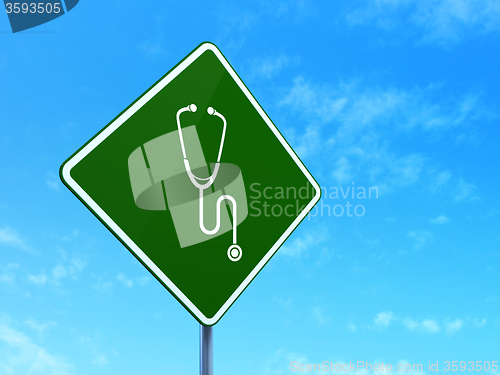 Image of Health concept: Stethoscope on road sign background