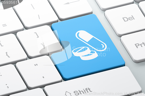 Image of Healthcare concept: Pills on computer keyboard background
