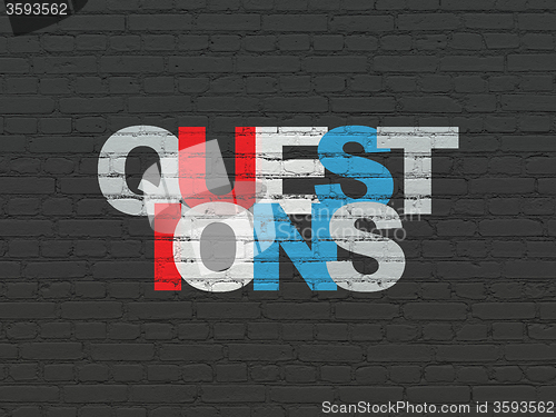 Image of Learning concept: Questions? on wall background