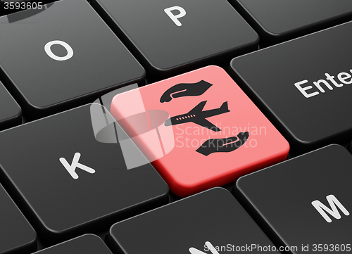 Image of Insurance concept: Airplane And Palm on computer keyboard background