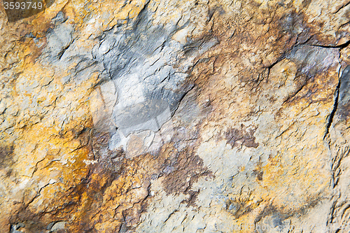 Image of rocks stone and red orange gneiss in the wall   morocco