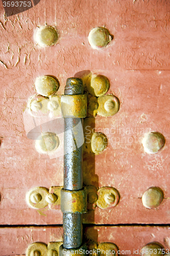 Image of brown  morocco in   the old wood    and rusty safe padlock 