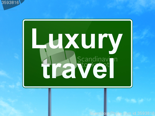 Image of Travel concept: Luxury Travel on road sign background