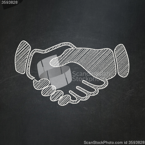 Image of Politics concept: Handshake on chalkboard background