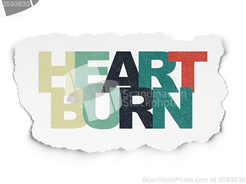 Image of Healthcare concept: Heartburn on Torn Paper background