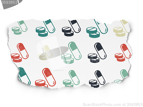Image of Health concept: Pills icons on Torn Paper background