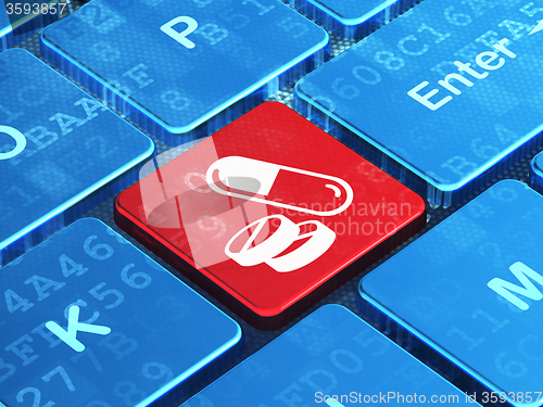 Image of Medicine concept: Pills on computer keyboard background