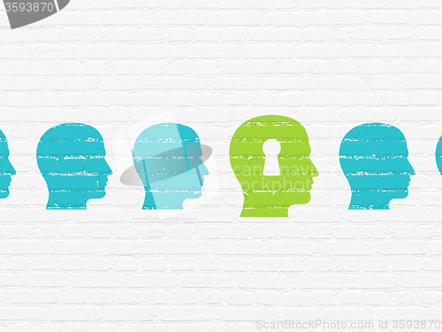 Image of Education concept: head with keyhole icon on wall background