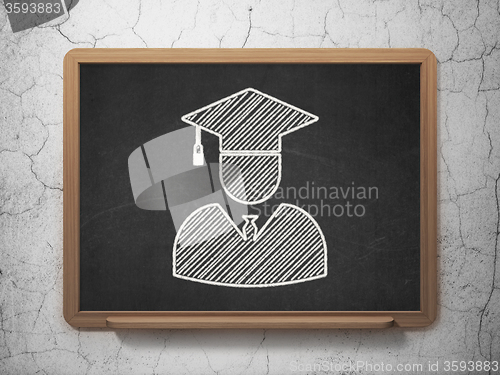 Image of Science concept: Student on chalkboard background