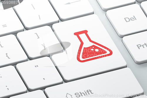 Image of Science concept: Flask on computer keyboard background