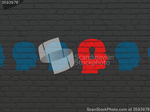 Image of Finance concept: head with keyhole icon on wall background