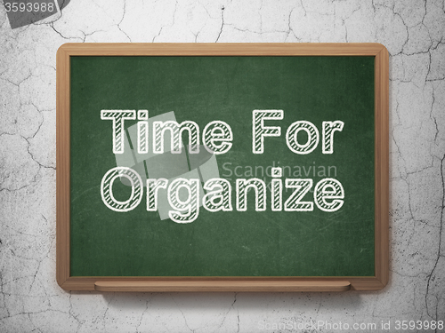 Image of Time concept: Time For Organize on chalkboard background