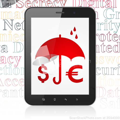 Image of Safety concept: Tablet Computer with Money And Umbrella on display