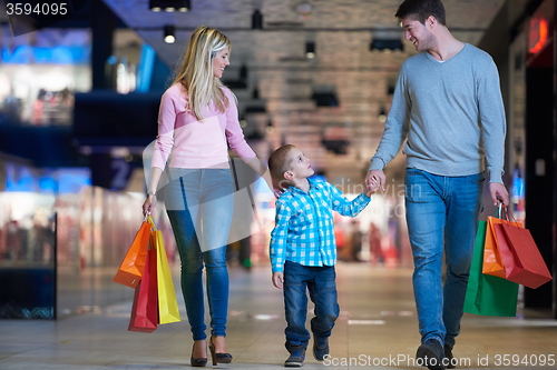 Image of young family with shopping bags