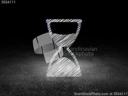 Image of Time concept: Hourglass in grunge dark room