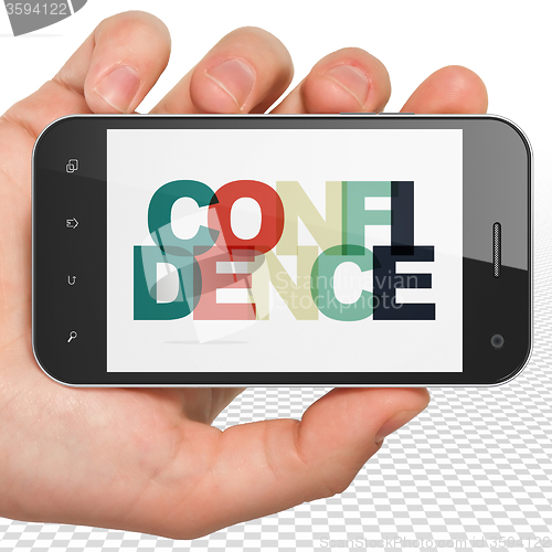 Image of Finance concept: Hand Holding Smartphone with Confidence on  display