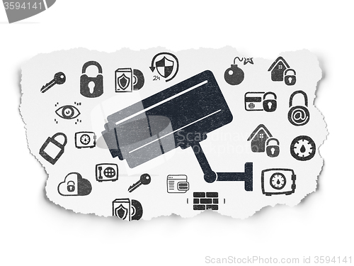 Image of Privacy concept: Cctv Camera on Torn Paper background