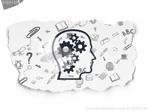 Image of Learning concept: Head With Gears on Torn Paper background