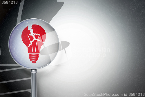 Image of Business concept:  Light Bulb with optical glass on digital background