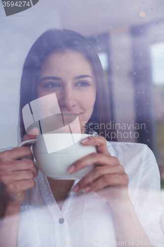 Image of beautiful young woman drink first morning coffee