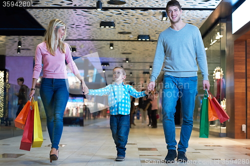 Image of young family with shopping bags