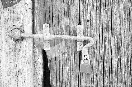 Image of europe old in  italy  antique close brown door and rusty lock  c