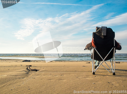 Image of woman resting on beach