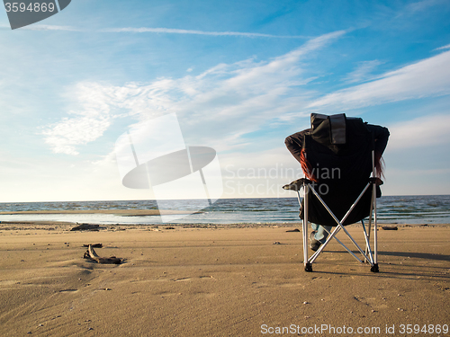 Image of woman resting on beach