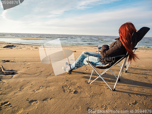 Image of woman sitting on deckchair