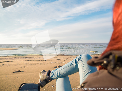 Image of woman watching sea on beach