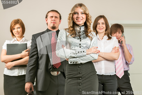 Image of Young business team with female boss