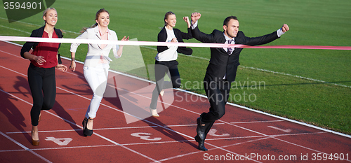 Image of business people running on racing track