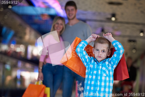 Image of young family with shopping bags