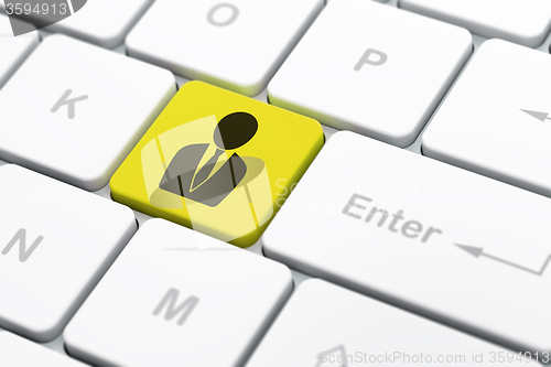 Image of Finance concept: Business Man on computer keyboard background