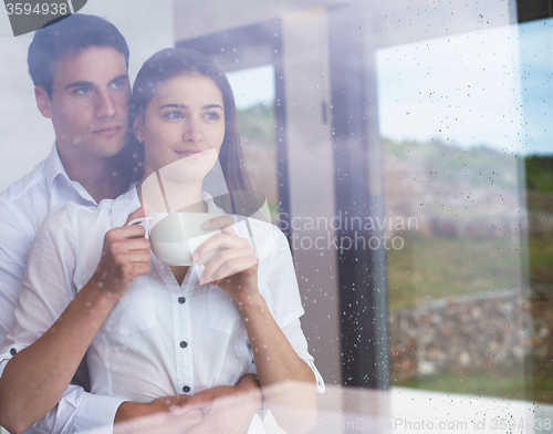 Image of relaxet young couple drink first morning coffee