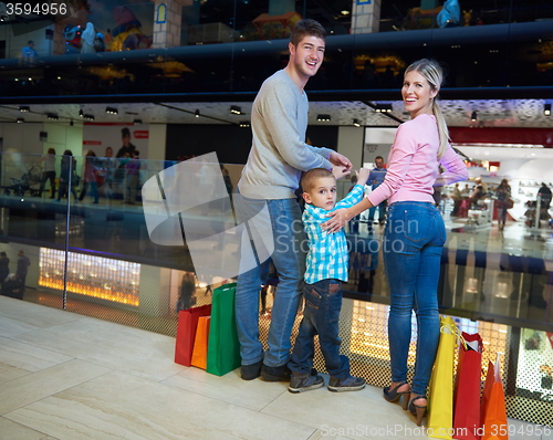 Image of young family with shopping bags