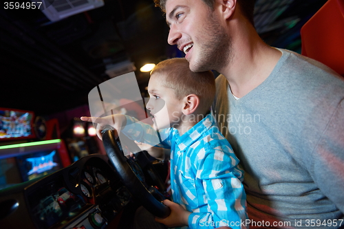 Image of father and son playing game in playground