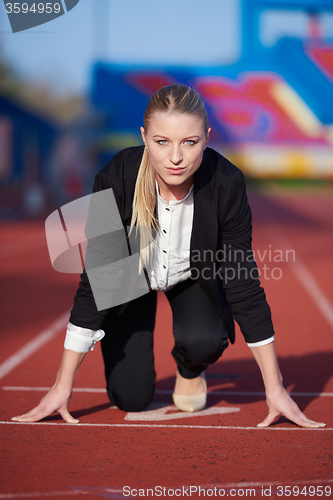 Image of business woman ready to sprint