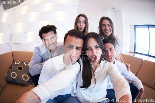 Image of group of friends taking selfie