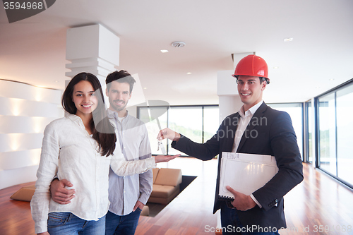 Image of couple buying new home with real estate agent