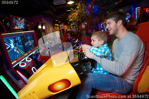 Image of father and son playing game in playground