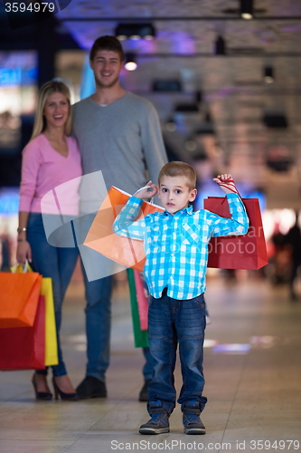 Image of young family with shopping bags