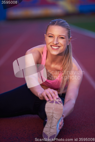 Image of sporty woman on athletic race track