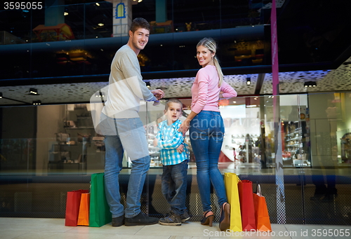 Image of young family with shopping bags
