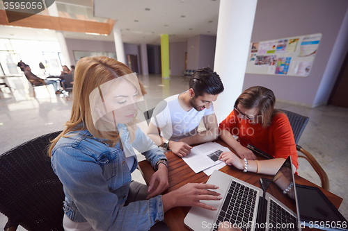 Image of students group working on school  project  together