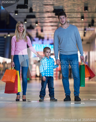 Image of young family with shopping bags
