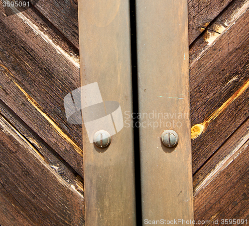 Image of stripped paint  door    in italy   ancian wood and traditional  